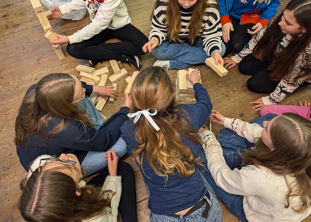 Group of children playing with wooden blocks