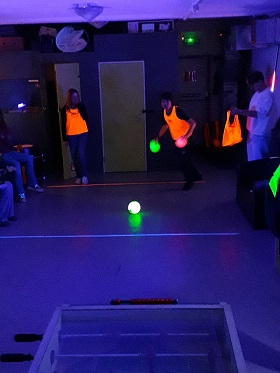 Children playing with glow in the dark balls