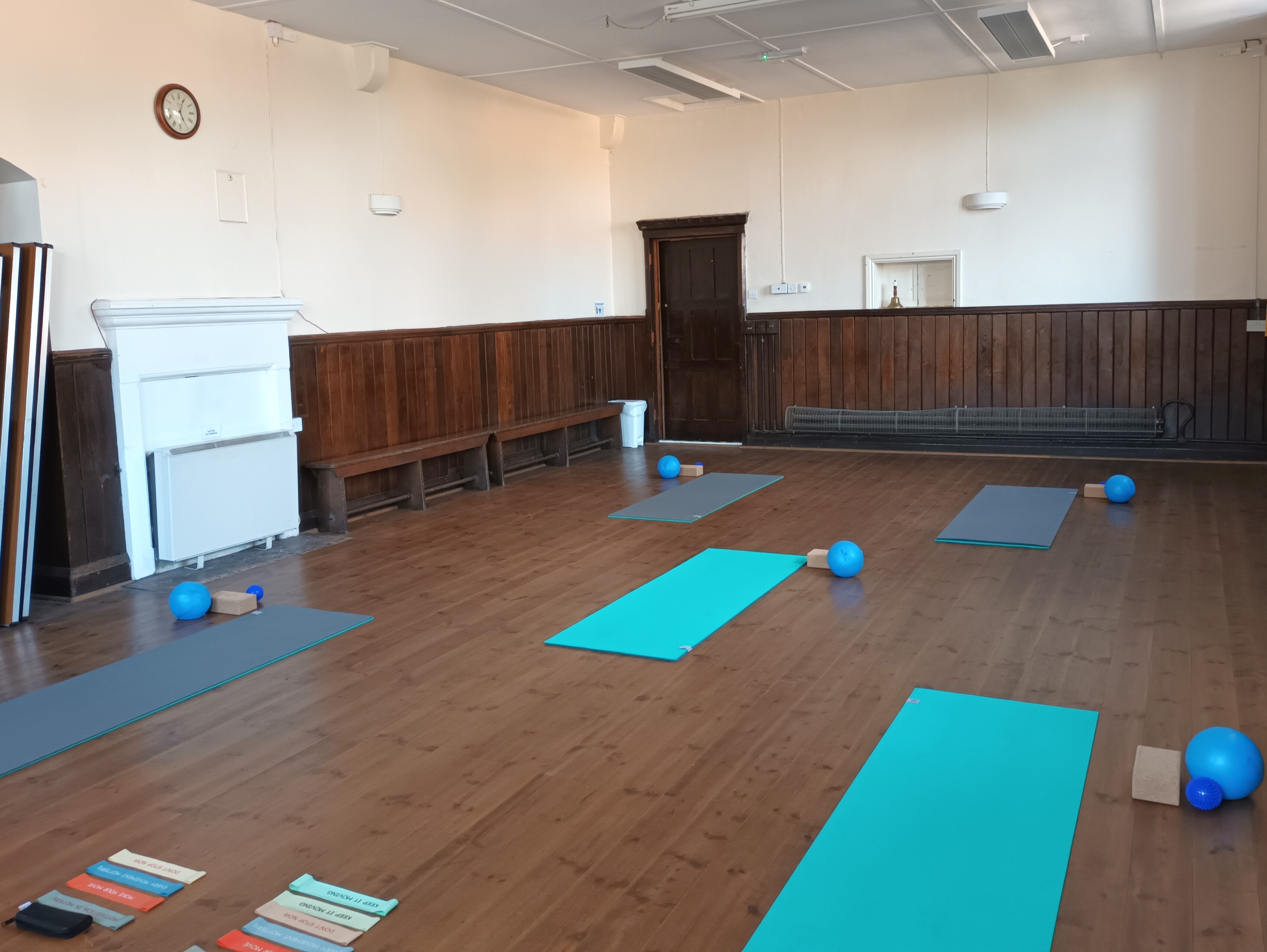 Pilates mats and balls in village hall
