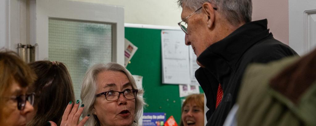 Two people talking animatedly 