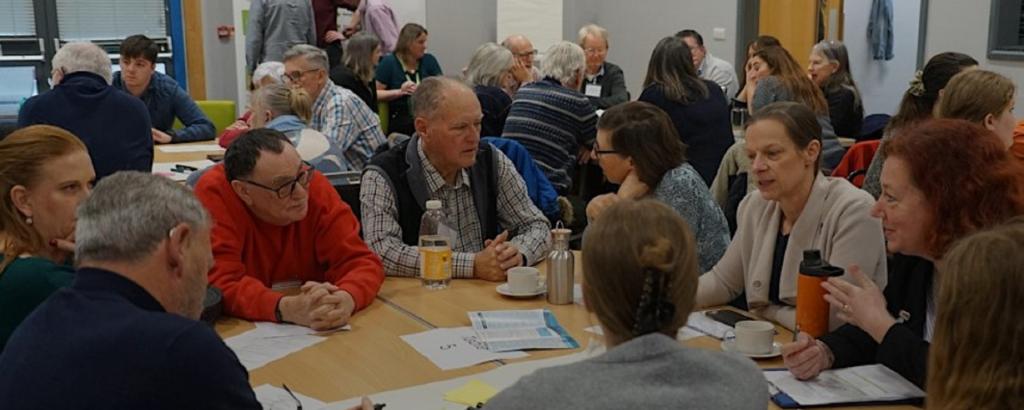 groups of people sat at tables