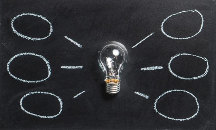 Lightbulb with blank bubbles coming out, ready for ideas