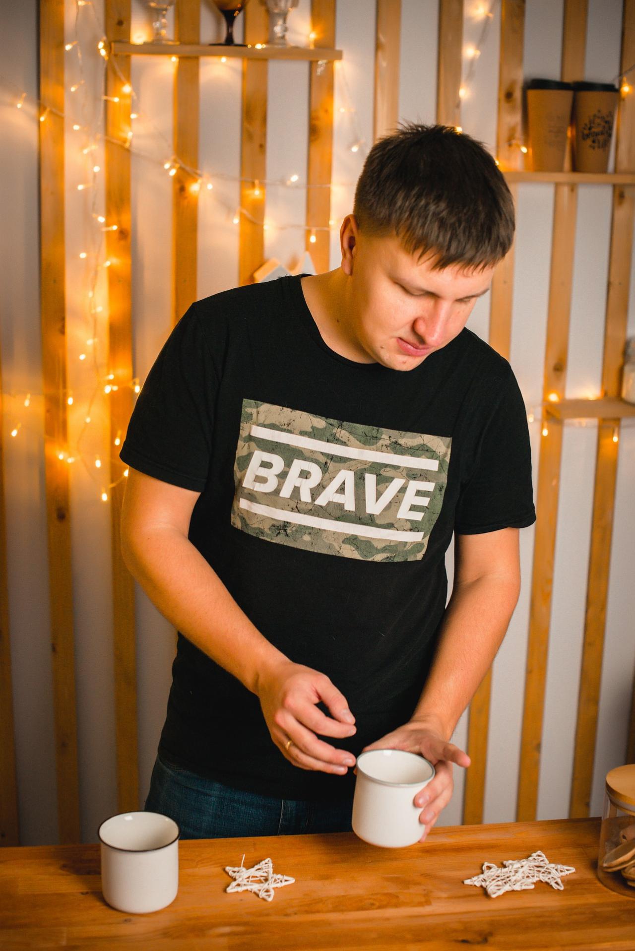 Young man preparing coffee