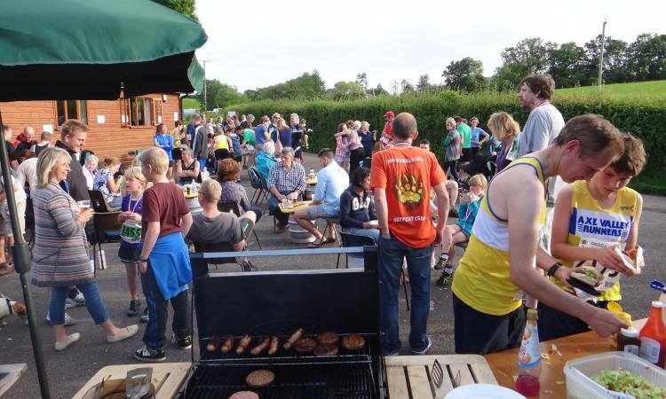 People gathering at Ug BBQ event